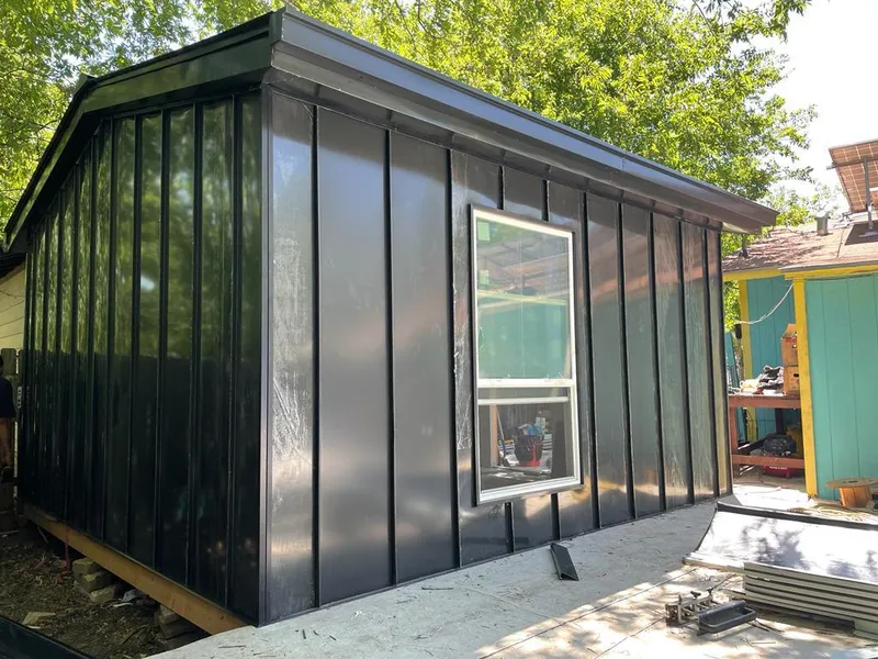 Black standing seam metal wall panels for Roof Inspection in Taylor